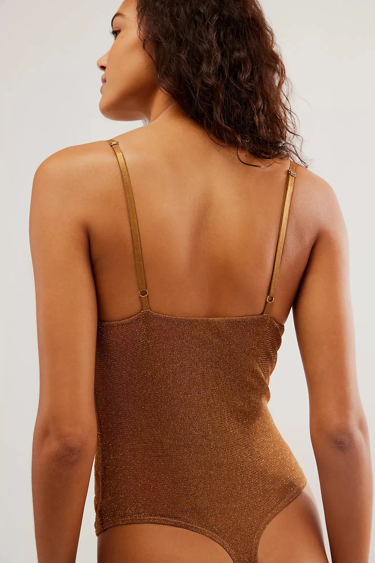 The Shimmer Night Rhythm Bodysuit by Free People - Bronze